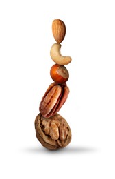 Stack of different nuts on white background