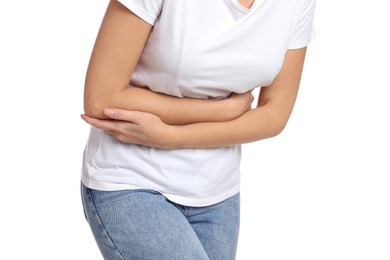 Woman suffering from stomach ache on white background, closeup. Food poisoning