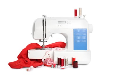 Photo of Modern sewing machine with red cloth and craft accessories isolated on white