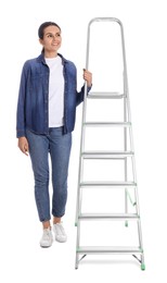 Photo of Young woman near metal ladder on white background