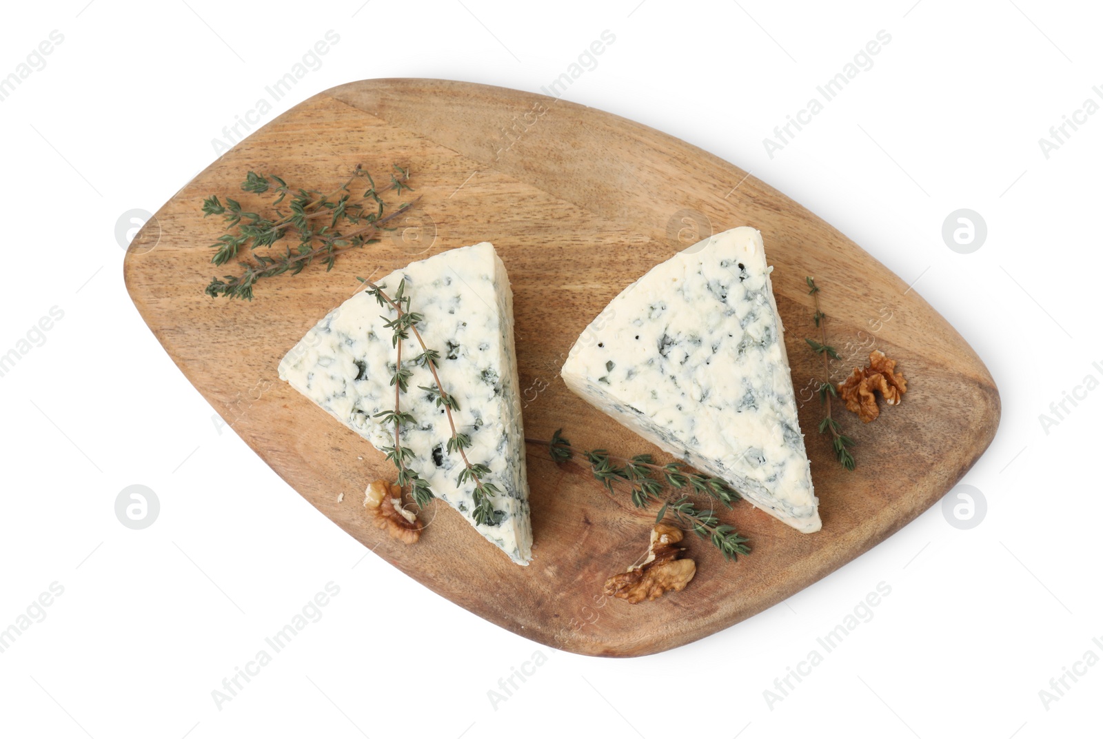 Photo of Tasty blue cheese with thyme and walnuts isolated on white, top view