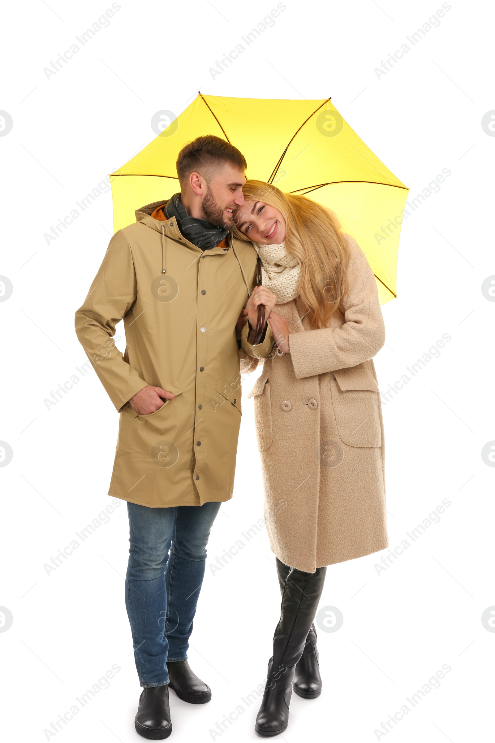 Photo of Full length portrait of beautiful couple with umbrella, isolated on white