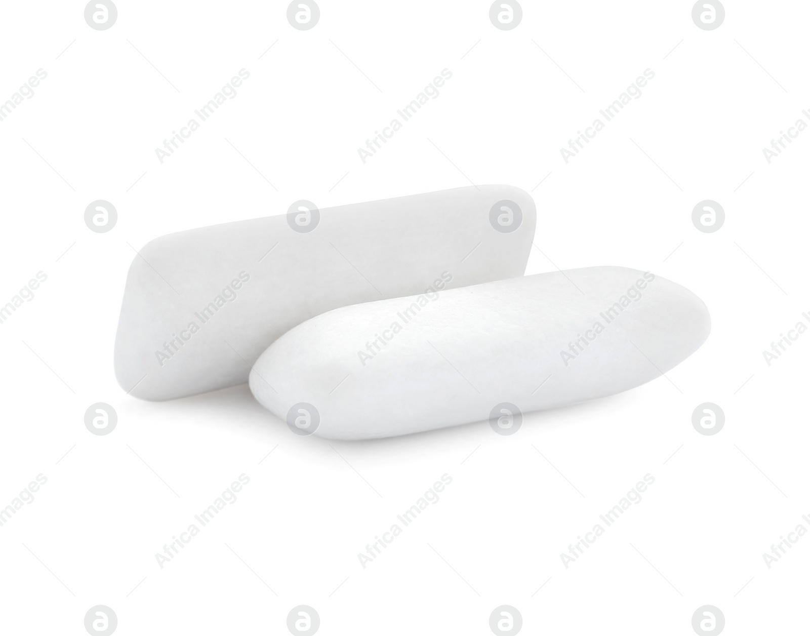 Photo of Two pieces of chewing gum on white background