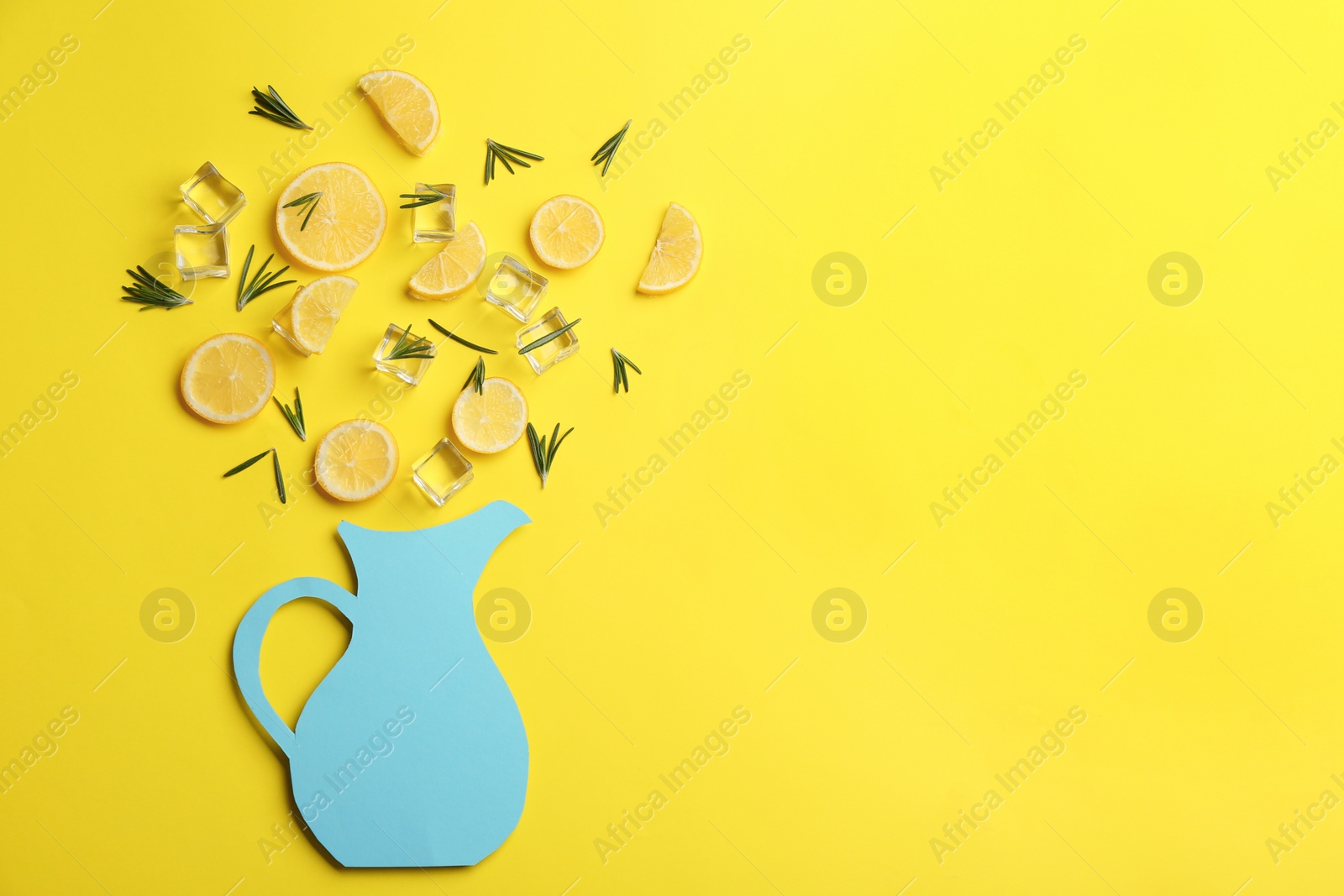 Photo of Creative lemonade layout with lemon slices, rosemary and ice on yellow background, top view. Space for text