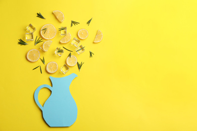 Photo of Creative lemonade layout with lemon slices, rosemary and ice on yellow background, top view. Space for text