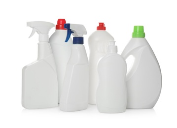 Photo of Bottles of different cleaning products on white background