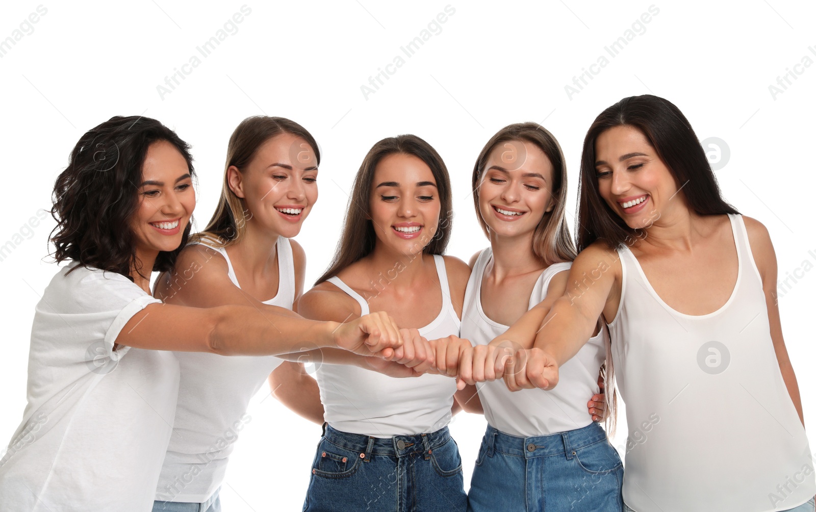 Photo of Happy women putting hands together on white background. Girl power concept