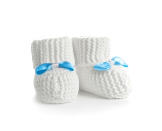 Handmade baby booties with bows isolated on white