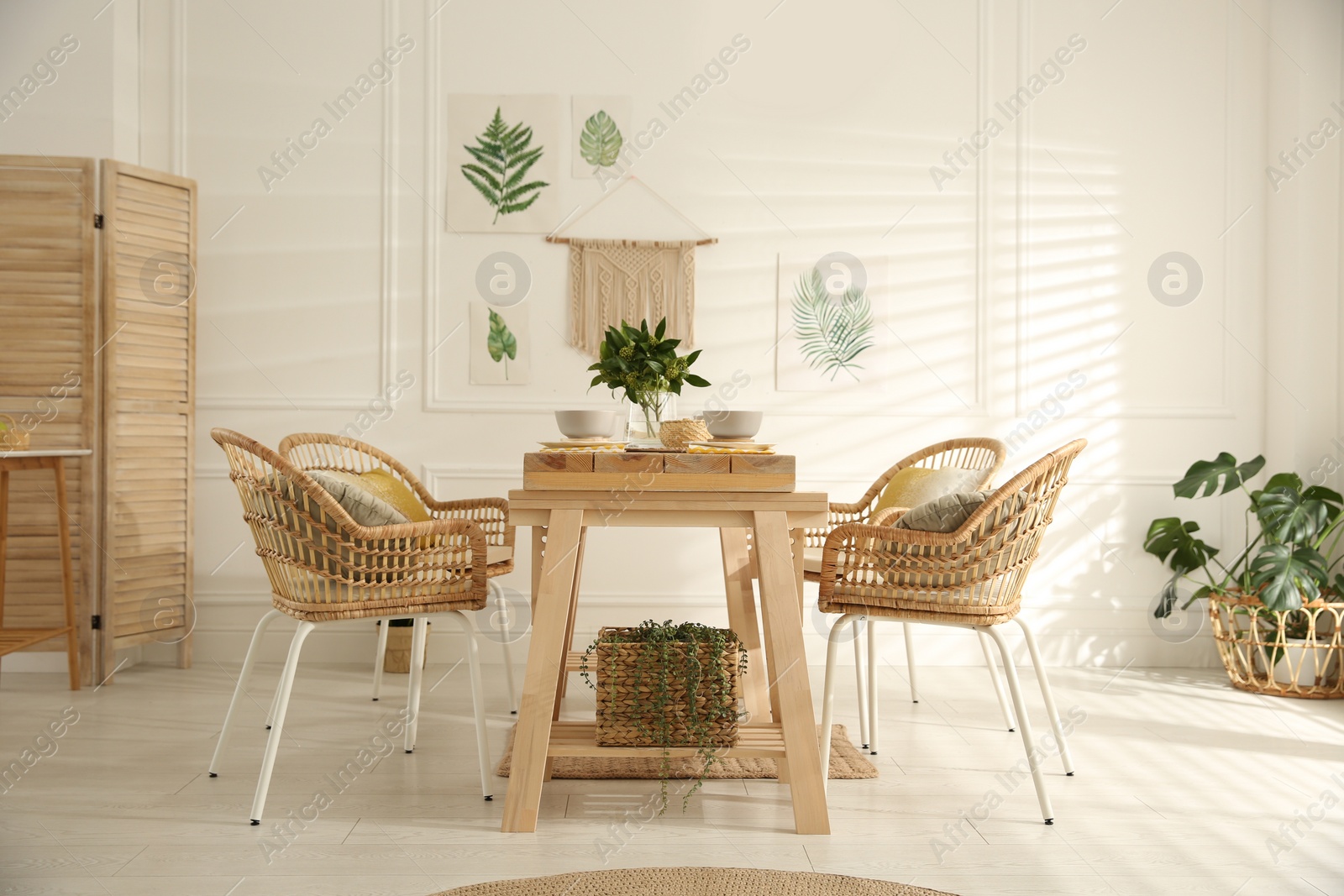 Photo of Stylish wooden dining table and chairs in room. Interior design