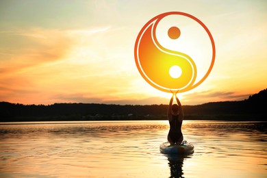 Image of Woman meditating on SUP board on river at sunset, back view. Yin and yang symbol