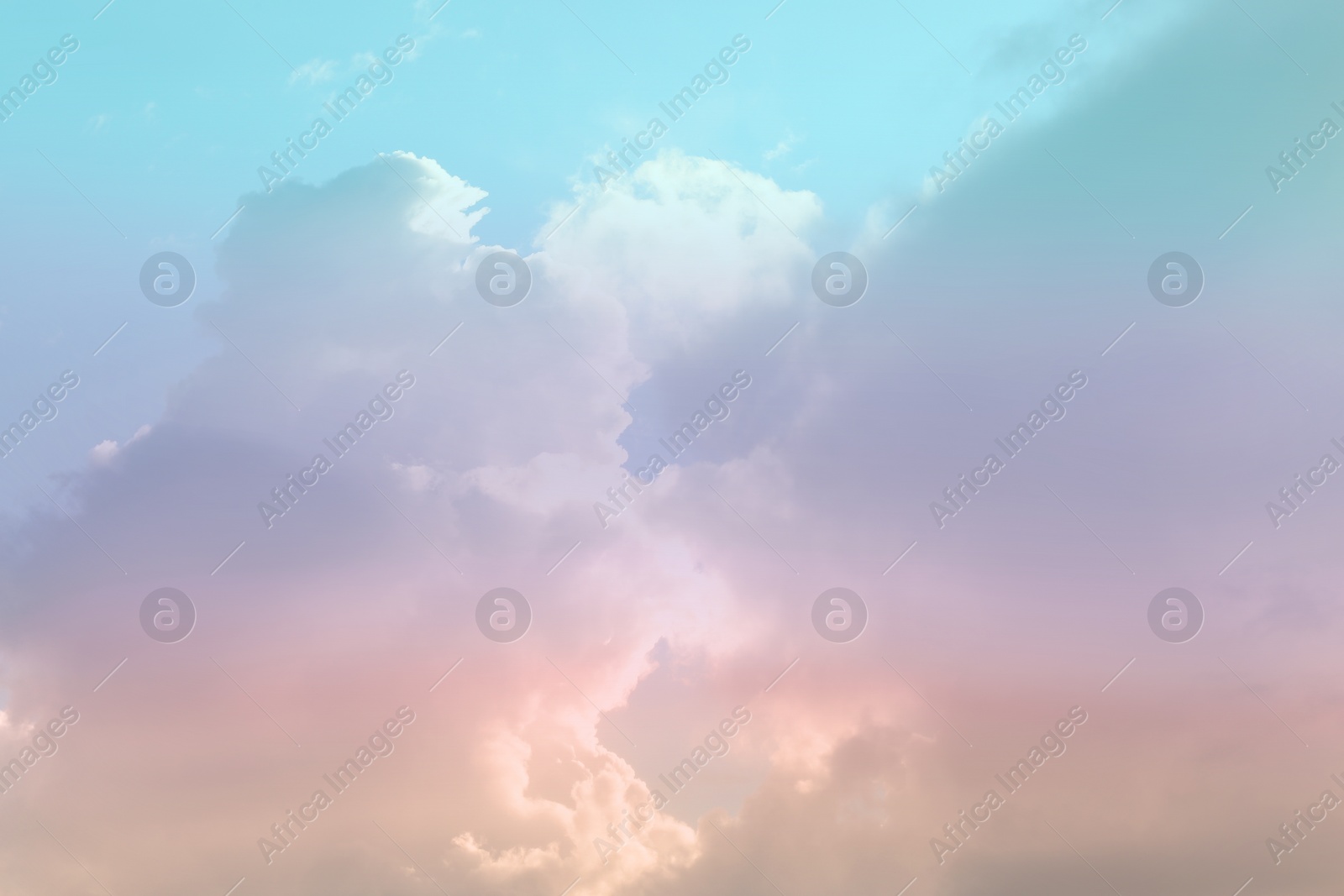 Image of Fantasy world. Picturesque view of beautiful magic sky with fluffy clouds, toned in pastel rainbow or unicorn colors