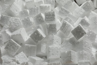 Photo of Polystyrene styrofoam pieces for packaging as background, closeup
