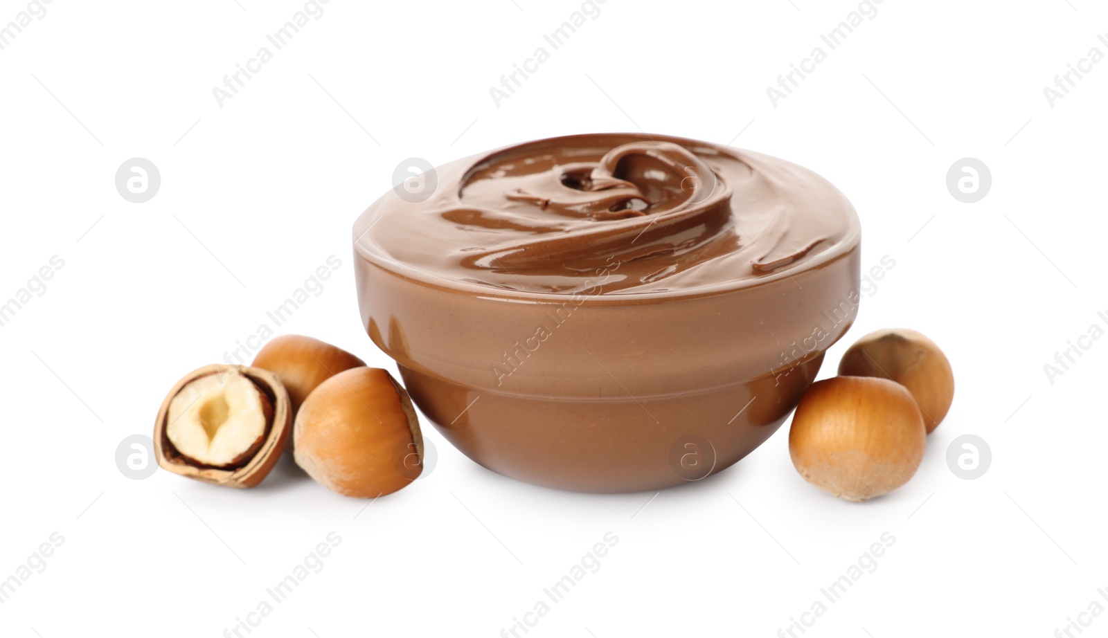 Photo of Glass bowl with tasty chocolate hazelnut spread and nuts on white background