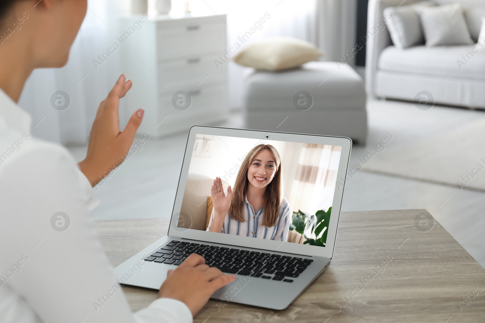 Image of Coworkers working together online. Woman using video chat on laptop, closeup