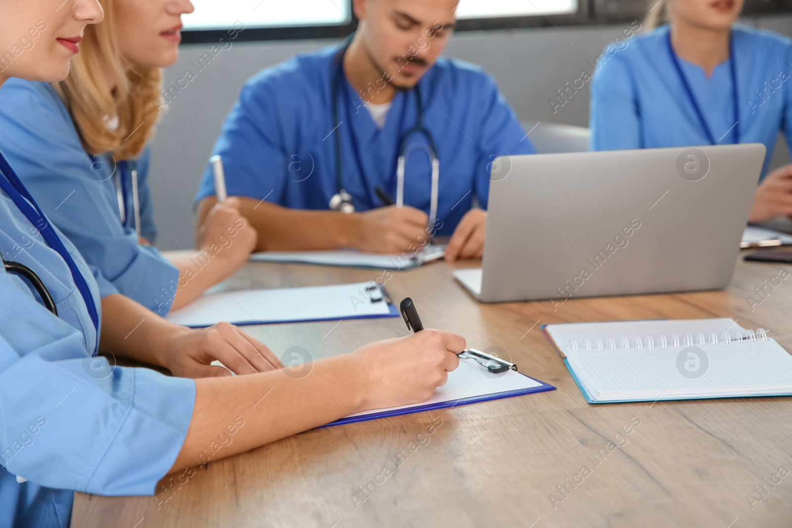 Photo of Medical students studying at university, closeup view