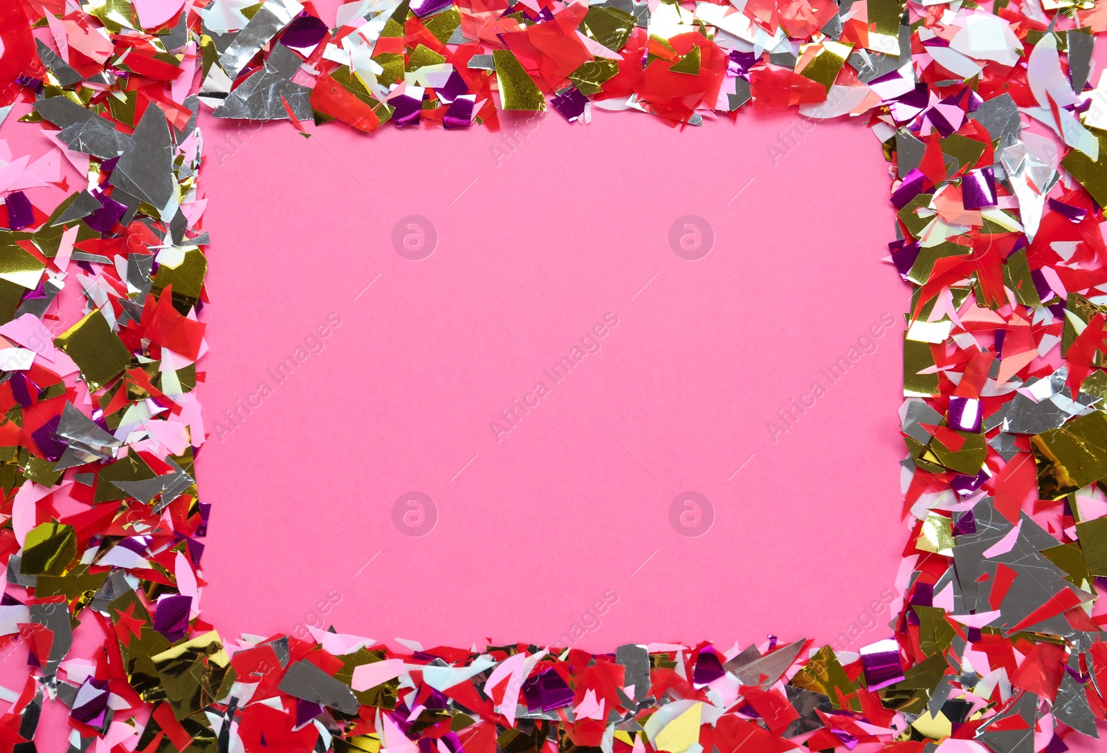 Photo of Frame of shiny colorful confetti on pink background, flat lay. Space for text