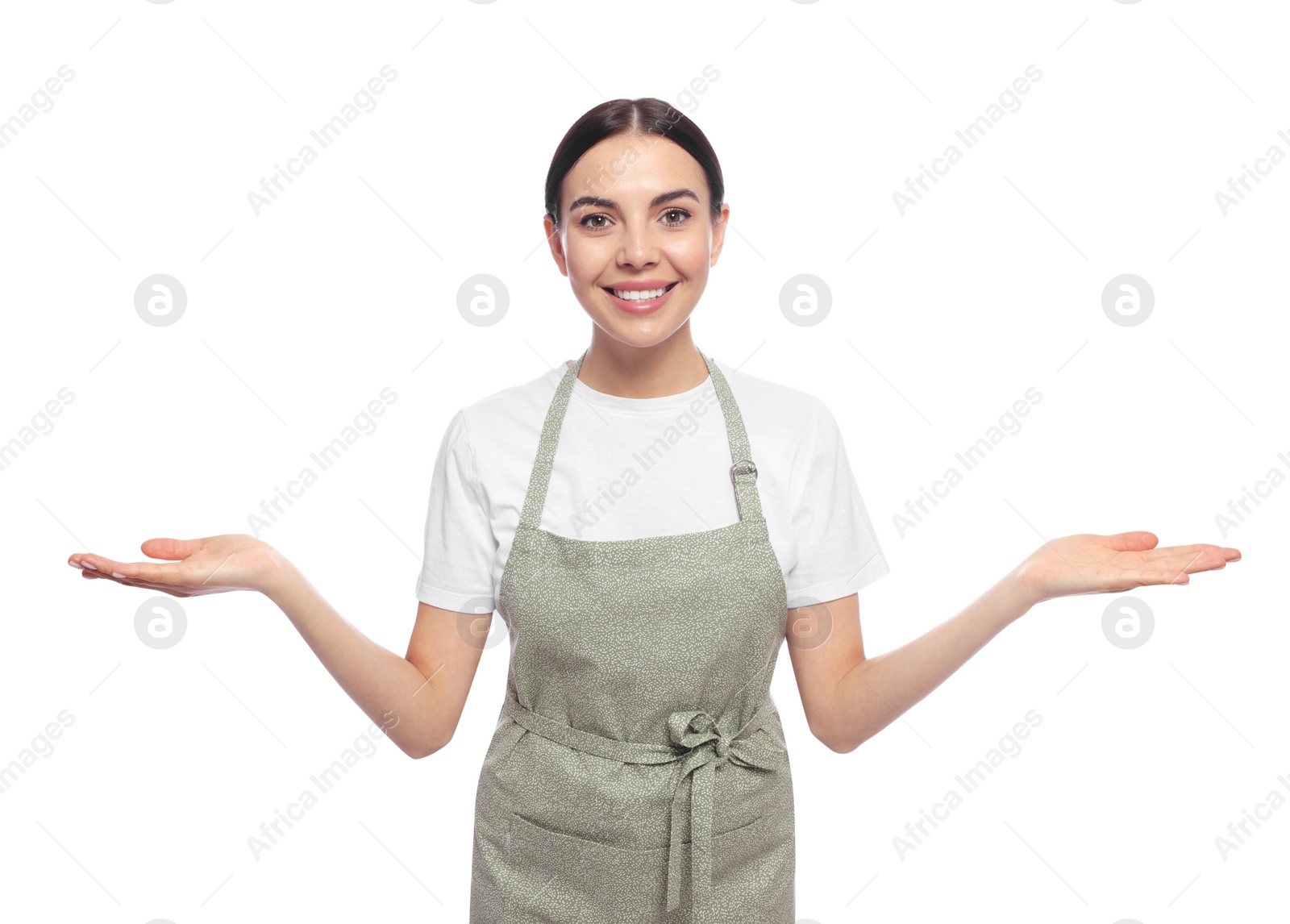 Photo of Young woman in light green apron on white background