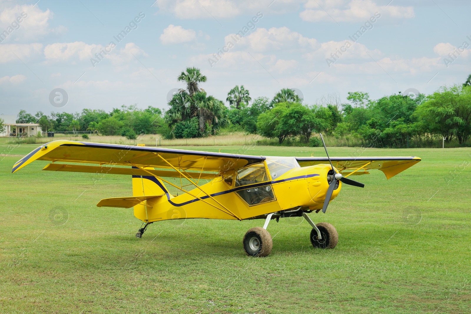 Photo of View of beautiful ultralight airplane in field on autumn day