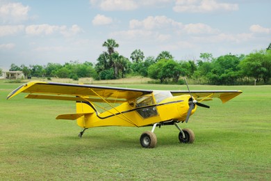 Photo of View of beautiful ultralight airplane in field on autumn day