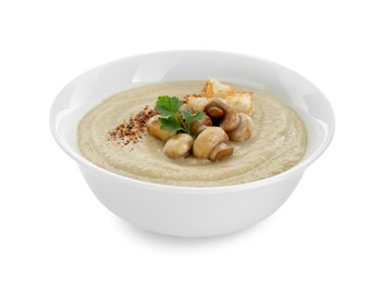 Delicious cream soup with mushrooms and croutons on white background