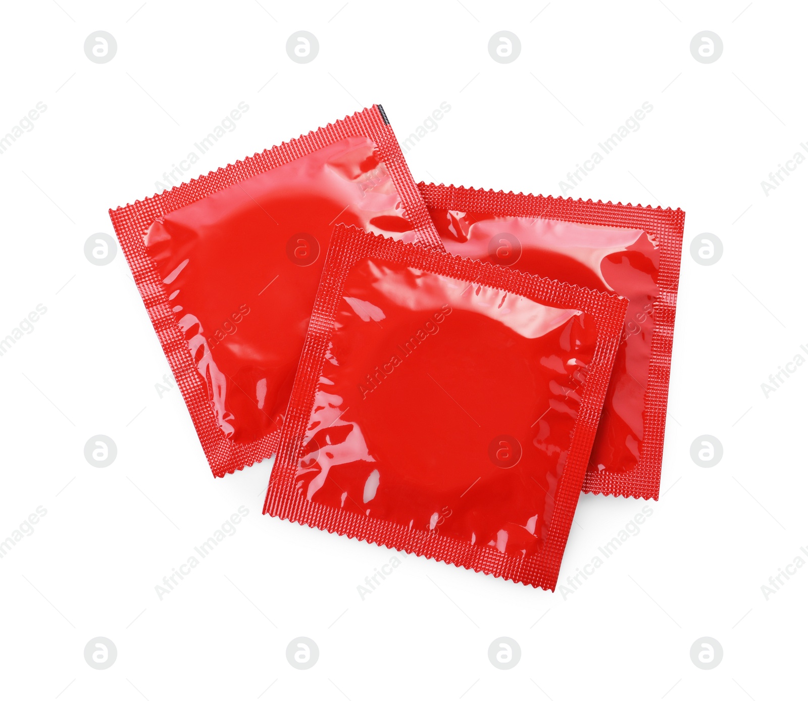 Photo of Condom packages isolated on white, top view. Safe sex