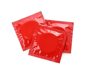 Condom packages isolated on white, top view. Safe sex