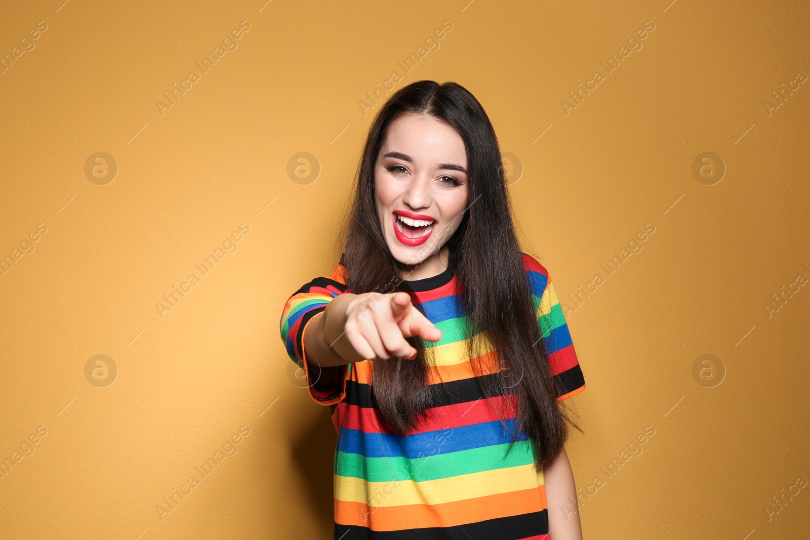 Photo of Portrait of beautiful young woman on colorful background