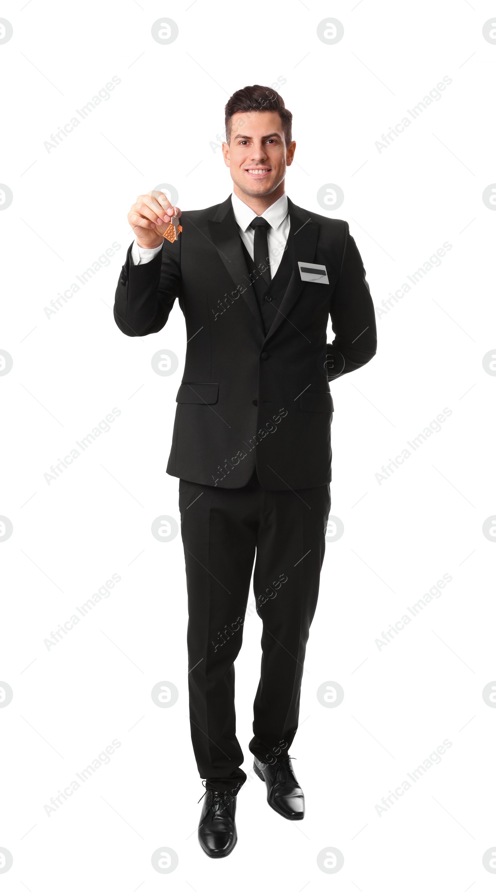 Photo of Happy receptionist in uniform holding key on white background