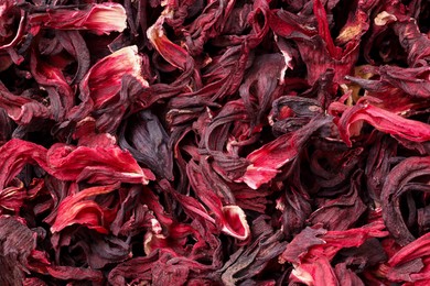 Photo of Dry hibiscus tea as background, top view