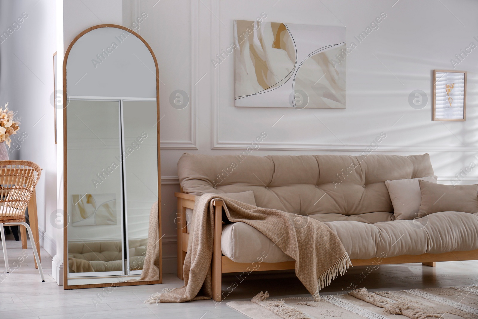 Photo of Apartment interior with large mirror and different furniture