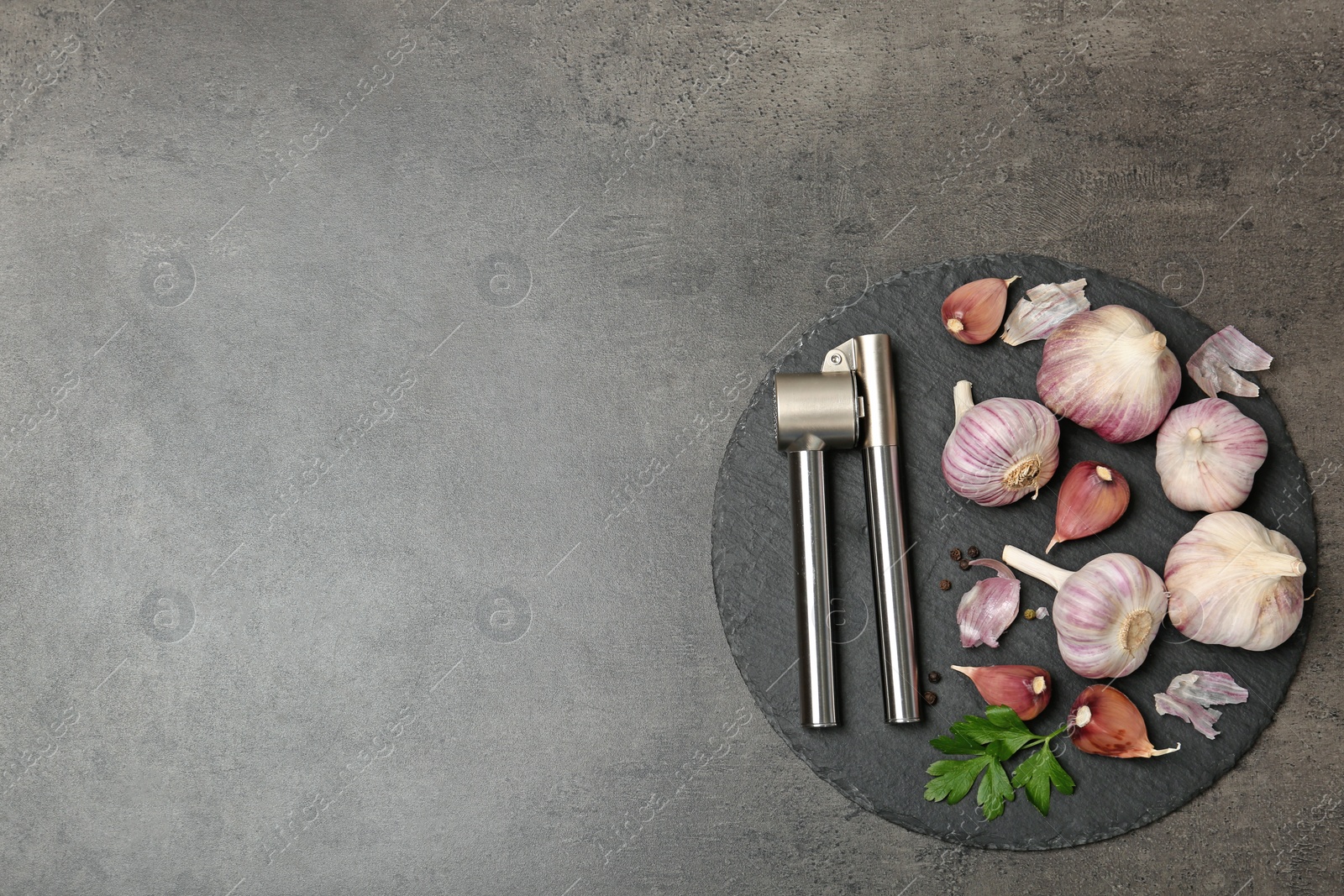 Photo of Flat lay composition with garlic press on table