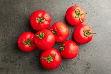 Photo of Fresh ripe tomatoes on grey background, top view