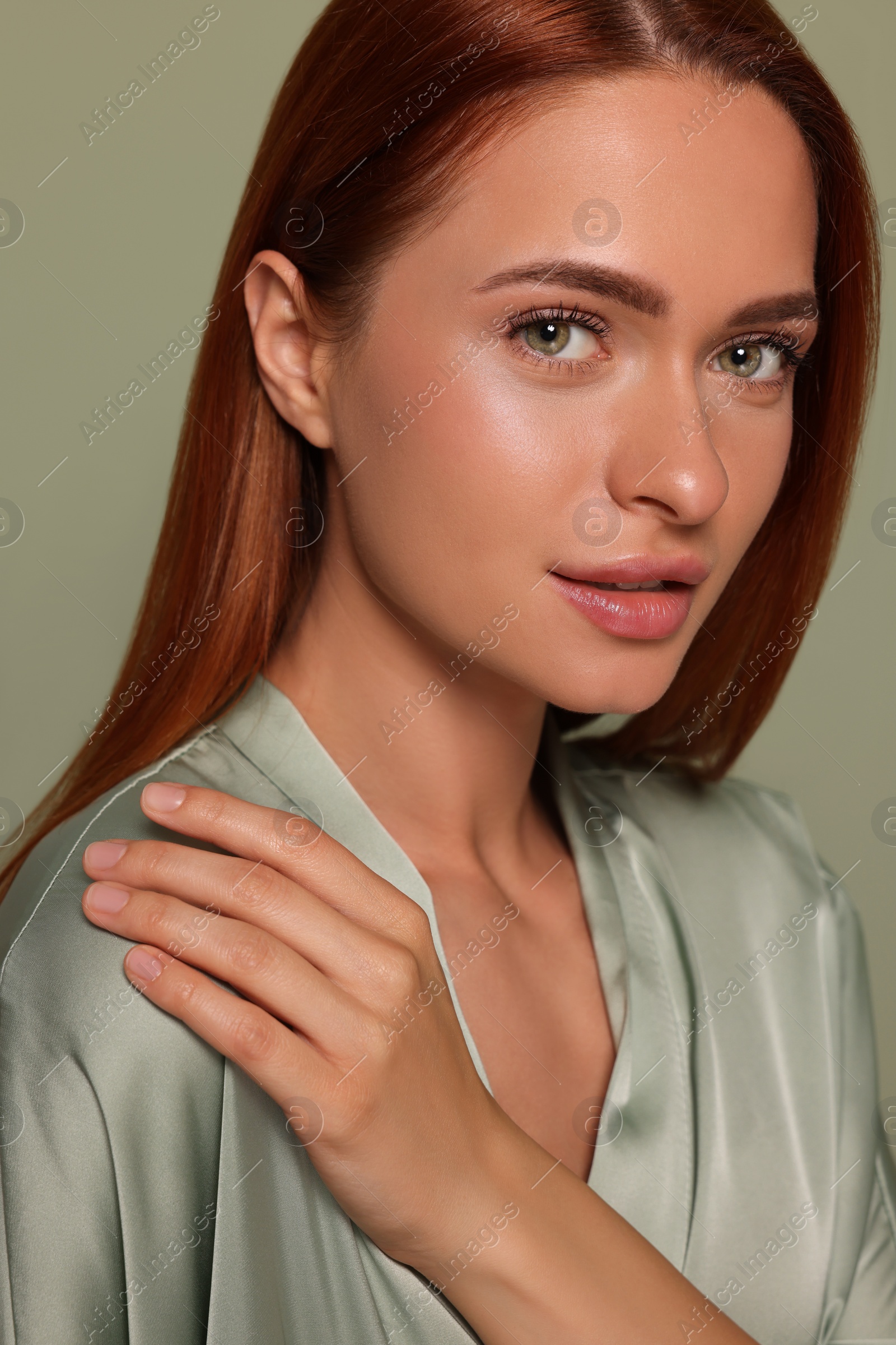 Photo of Portrait of beautiful young woman on green background