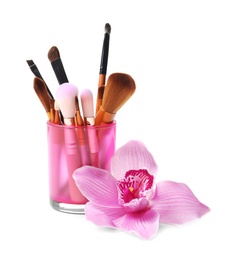 Photo of Holder with makeup brushes of professional artist on white background