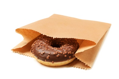 Paper bag with donut on white background