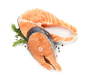 Photo of Fresh salmon steaks with rosemary and pepper mix on white background, top view