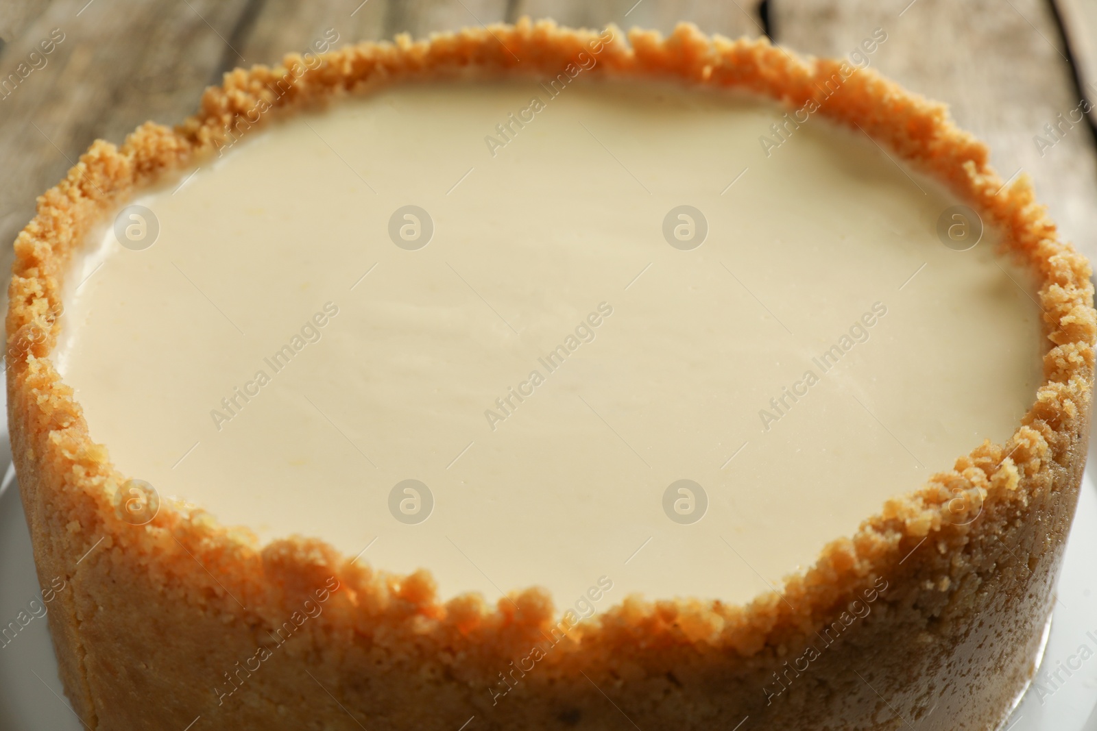 Photo of Tasty vegan tofu cheesecake on table, closeup