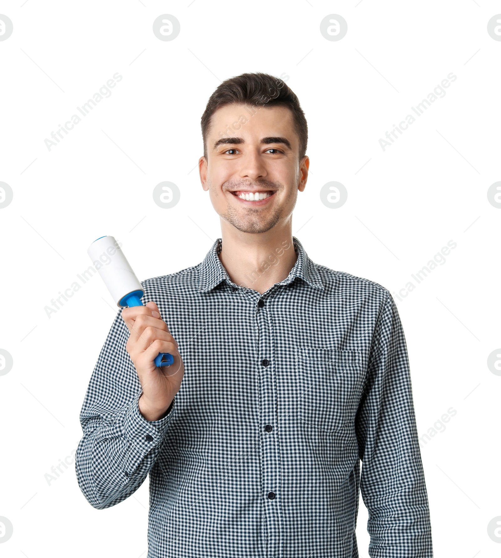 Photo of Young man with lint roller on white background. Dry-cleaning service