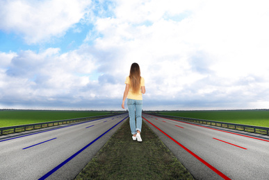 Image of Woman walking outdoors. Concept of choice between different ways 