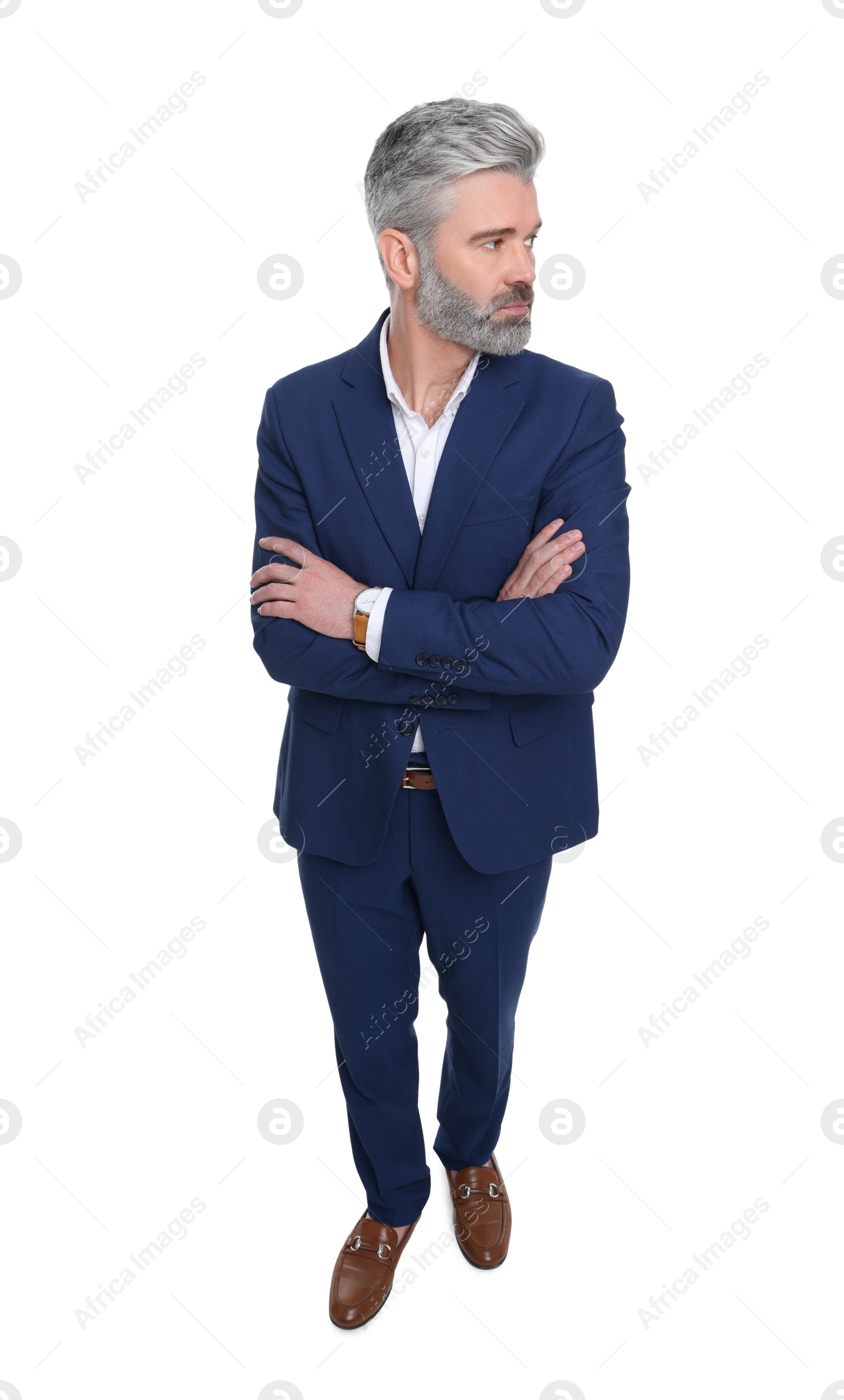 Photo of Mature businessman in stylish clothes posing on white background