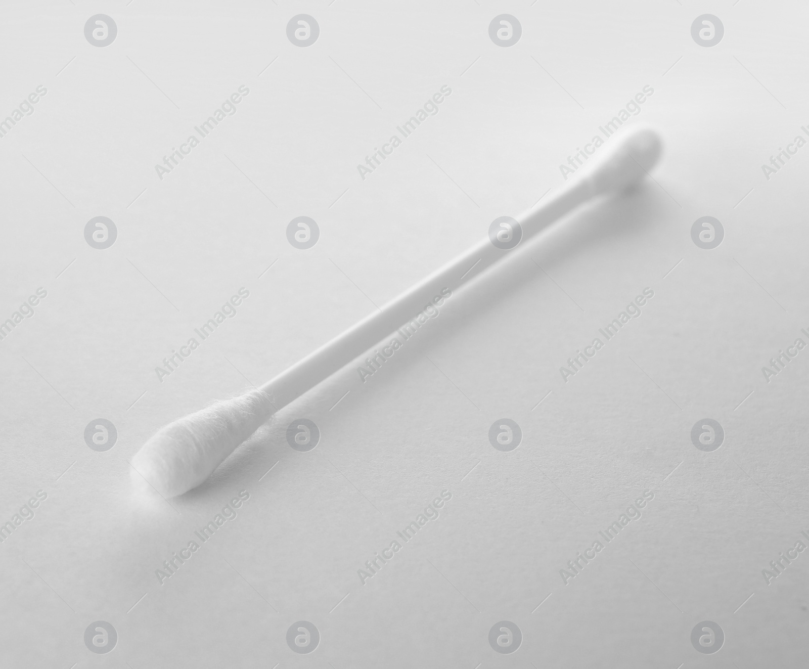 Photo of Clean cotton bud isolated on white. Hygienic accessory