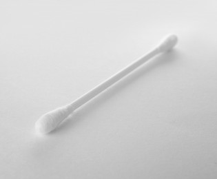 Photo of Clean cotton bud isolated on white. Hygienic accessory