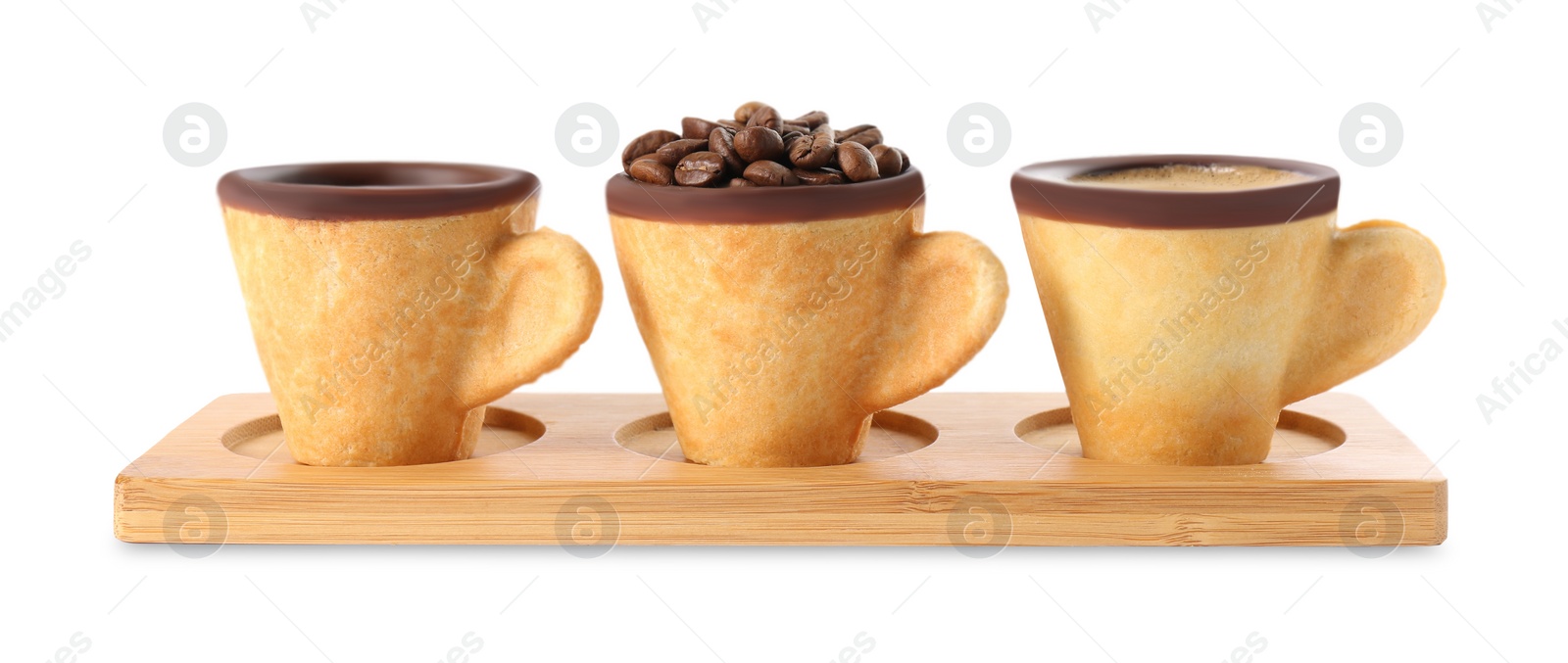 Photo of Edible biscuit cups with espresso, coffee beans and empty one on white background