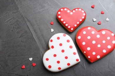 Photo of Valentine's day cookies on grey table, flat lay. Space for text