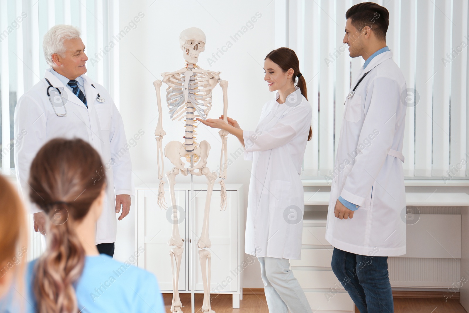 Photo of Medical students having lecture in orthopedics at clinic