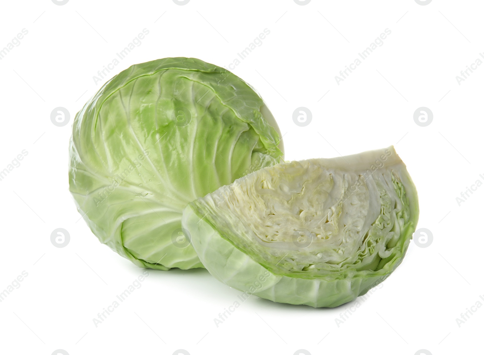 Photo of Whole and sliced cabbages on white background. Healthy food