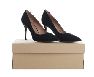 Photo of Pair of stylish shoes and cardboard box on white background