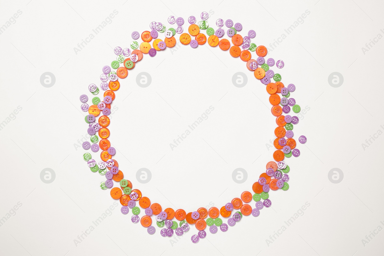 Photo of Frame of colorful sewing buttons on white background, top view. Space for text
