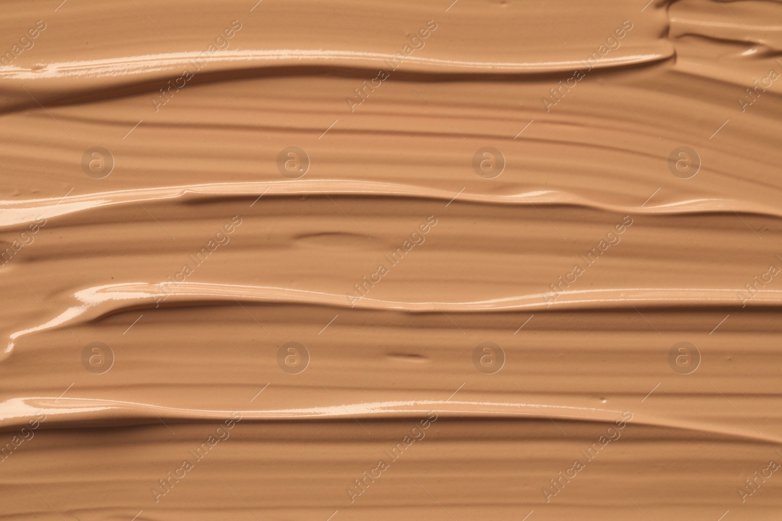 Photo of Texture of liquid skin foundation as background, closeup