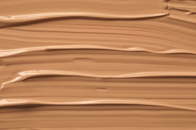 Photo of Texture of liquid skin foundation as background, closeup